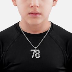 Elevate your style with the 78 Number Pendant with Chain Kids Necklace, designed for those who want to showcase their individuality on and off the field. Crafted from high-quality stainless steel, this necklace is not only stylish but also built to withstand the rigours of an active lifestyle. Choose from various lengths—18", 23", and 28"—to find the perfect fit that complements your look. Featuring a polished 18K gold plated stainless steel pendant, this necklace resists rust and tarnish, ensur Lion Pendant, Helmet Visor, Kids Necklace, Pendant With Chain, Helmet Accessories, Chain Necklaces, Letter Pendants, Stainless Steel Pendant, Black Stainless Steel