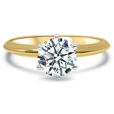 a yellow gold engagement ring with a round brilliant cut diamond in the center, on a white background