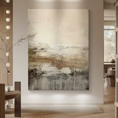 a painting hanging on the wall in a room