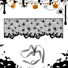 a halloween scene with bats, spider webs and pumpkins hanging from the ceiling