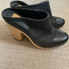 Like New Black Leather Clogs From Dolce Vita. Purchased At Anthropologie And Never Worn. Black Almond Toe Clogs For Spring, Spring Black Almond Toe Clogs, Black Leather Clogs With Almond Toe, Chic Black Clogs With Stacked Heel, Black Leather Almond Toe Clogs, Black Almond Toe Clogs With Removable Insole, Leather Clogs With Stacked Heel And Almond Toe, Chic Clogs With Wooden Heel And Round Toe, Chic Black Clogs With Leather Sole