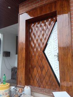 an open wooden door on the side of a brick building