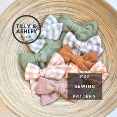 several small bows are sitting in a woven bowl with the text,'free sewing pattern '