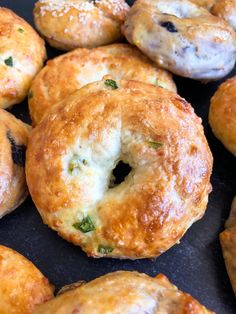 there are many bagels that have been cooked on the stove top and one is filled with cheese