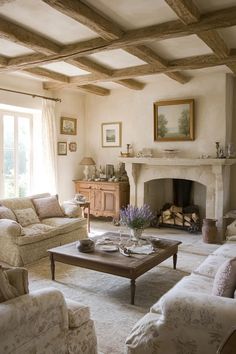 a living room filled with furniture and a fire place