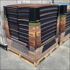 several stacks of folded and stacked cardboards on pallets in a warehouse or storage area