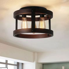 a light fixture hanging from the ceiling in a kitchen