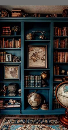 a bookshelf filled with lots of books next to a rug