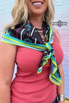 Add a touch of playful and wild style to any outfit with the Wickenburg Wild Rag/ Scarf. Featuring a bold aztec and roper print and colorful design, this versatile piece can be worn as a top, in your hair, on your bag & MORE. Embrace your adventurous spirit with this must-have accessory! 36" x 36" 100% Polyester Nfr Fashion, Western Graphic Tees, Rodeo Outfits, Rodeo Fashion, Wild Rag, Cowgirl Outfits, Cowgirl Style, Colorful Design, Wholesale Clothing