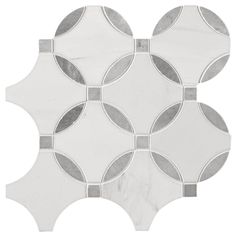 a white and grey tile with circles on it