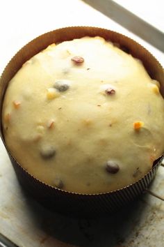 a cake in a pan sitting on top of a stove