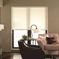 a living room filled with furniture and a fire place in front of a mirror on the wall