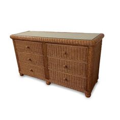 a wicker dresser with glass top and drawers on the bottom drawer, side view