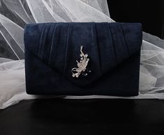 Add a touch of elegance to your evening ensemble with this stunning Navy Blue Suede Evening Clutch Bag. This Dark Blue Gothic Wedding Handbag is perfect for a bride or bridesmaid looking to make a statement on the big day. Whether you're attending a formal event or a wedding, this Envelope Purse is the perfect accessory to complete your look. Handcrafted with quality materials, this clutch bag is both stylish and functional, making it a versatile addition to your accessory collection. Colour: na Blue Clutch Evening Bag For Wedding, Blue Wedding Clutch Evening Bag, Elegant Blue Clutch For Events, Elegant Blue Evening Bag, Elegant Blue Bag For Special Events, Elegant Blue Bags For Events, Elegant Blue Bag For Events, Elegant Blue Bags For Wedding, Elegant Blue Bag For Wedding