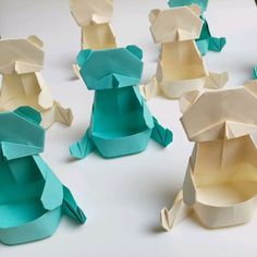 several pieces of paper are folded in the shape of animals