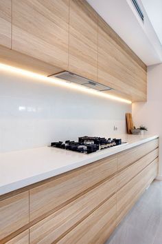 a kitchen with wooden cabinets and white counter tops, along with the words international and external wood doors