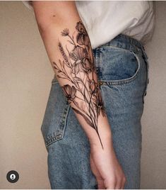 a person with a flower tattoo on their arm