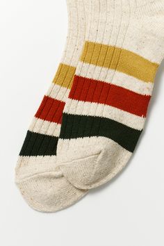 This model is the updated version of ‘R1432 PARK STRIPE CREW SOCKS’ and knitted with different yarn. The design of these socks is inspired by outdoor blankets, and the rugged fabric with neps is knitted with an old-type low-gauge knitting machine. The vivid stripes on the natural-feel fabric characterize this item. Choose from Ivory or Beige. Specifications: Made from 45% acrylic, 24% cotton, 12% silk, 9% wool, 9% polyester, 1% polyurethane. Sizing Help: Small (23-25cm) fits US women's 5.5~8 and Sporty Multicolor Winter Socks, Striped Socks Knit, Socks Stripes, Fade-resistant Sporty Outdoor Socks, Retro Striped Cotton Socks, Childrens Shop, Outdoor Blankets, Fall Bags, Tech Cases