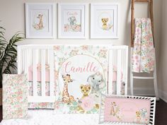 a baby's room with pink and white decor, including a crib bedding set