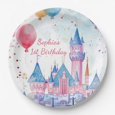 a birthday plate with a castle and balloons on it