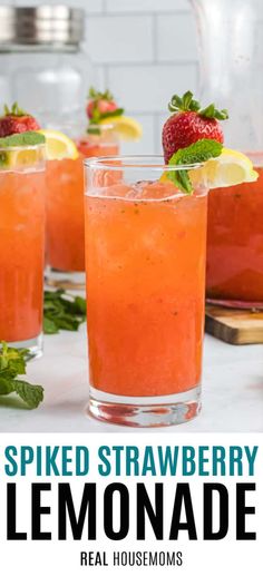 two glasses filled with watermelon lemonade and topped with strawberries on the side