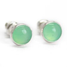 These Chrysoprase stud earrings are so beautiful.  They are a pretty light pale green ~ perfect for spring! They feature 6mm Chrysoprase cabochons.  Completely handmade in my studio using all sterling silver.  I have hand soldered the bezels to the studs and mounted the stones within them.  The posts are sterling silver. 6m Chrysoprase cabochonsStone type: Natural Color: Pale to light Green - the colors vary from stone to stone as they are completely natural925 Sterling Silver~not platedDeluxe L Chrysoprase Jewelry, Spring Jewelry, May Birthstone, Jewelry Studio, Cabochons Stones, Gemstone Studs, Lampwork Glass Beads, Green Gemstones, Seed Bead Jewelry