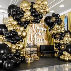 black and gold balloon arch with happy new year sign