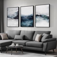 a living room with two paintings on the wall