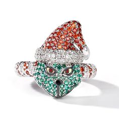 Do you still remember a green monster in that Christmas fantasy comedy film? Inspired by this film, this ring features a vivid monster with a green face and red Christmas hat. Beautifully handcrafted in sterling silver, it shimmers with sparkling stones, bright eyes and radiant smile. You will instantly fall in love with this cute design.Width: 21.1 mmHeight: 7.9 mmThickness: 4.5 mmMaterial: 925 SilverPlating Color: Silver, Black Christmas Novelty Silver Jewelry, Novelty Red Christmas Jewelry, Red Novelty Christmas Jewelry, Red Novelty Jewelry For Christmas, Red Christmas Novelty Jewelry, Monster Christmas, Christmas Ring, Comedy Film, Fashion Edgy