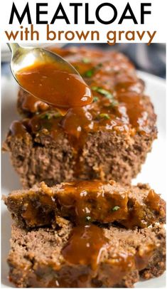 meatloaf with brown gravy is on a white plate and has a spoon in it