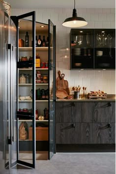 a kitchen with lots of shelves and cupboards