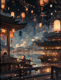 a man sitting on a bench next to a lake at night with lanterns floating in the sky