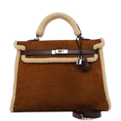 This rare Teddy Kelly bag in the Retourne style is in shearling and Ebene barenia leather with palladium hardware and has tonal stitching, a front toggle closure, a clochette with lock and two keys, a single rolled handle and an optional shoulder strap.The interior is lined in Ebene chevre and features one zip pocket with an Hermes engraved pull and two open pockets on opposite side. Collection: L squareOrigin: FranceCondition: Pre-owned ; Excellent to Mint - This bag retains its structure. The Winter Bags, Hermes Kelly Bag, Kelly Bag, Hermes Handbags, Hermes Bags, Brown Bags, Gorgeous Bags, Hermes Bag, Luxury Accessories