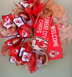 the wreath is decorated with footballs and burlocks