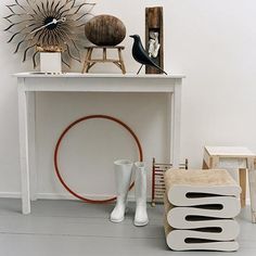 a white table topped with vases and other items