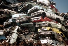 a pile of old cars sitting next to each other