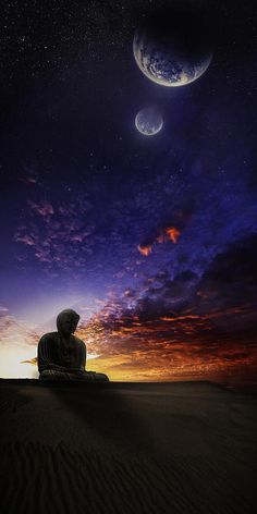 a buddha statue sitting on top of a sandy beach under a night sky filled with stars and planets