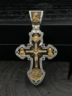 Silver Orthodox cross with black wood and gilding. Art. 0169 ✔️Silver 925 + yellow 24K gilding 999 ✔️Black ebony tree ✔️Production is possible in two size options: ✔️Weight +-17 grams ✔️Size 60/33.7 mm (including the lug) ✔️Production is possible in the size of 50/28 mm! ✔️The cross depicts: 🔘Jesus Christ, 🔘 Holy Mother of God 🔘Mykola the Miracle Worker, 🔘 Archangel Michael, 🔘 George the Victorious 🔘Guardian Angel 🔘 Panteleimon healer 🔘 Serhii Radonezhskyi 🔘 Chrism ✔️Possible production Luxury Cross Pendant Necklace, Luxury Pendant Cross Necklace Gift, Luxury Silver Cross Necklace As Gift, Luxury Silver Cross Necklace For Gift, Luxury Cross Necklace As Gift, Large Cross Pendant Necklace, Luxury Handmade Cross Jewelry, Gilding Art, The Miracle Worker