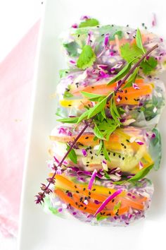 a white plate topped with lettuce and carrots