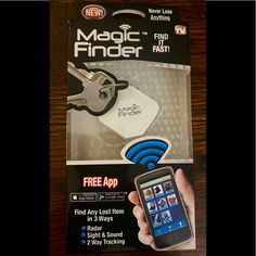 a hand holding a smart phone in front of a package with the text magic finder on it