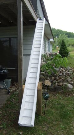 a ladder leaning up against a house