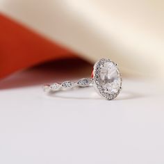 The Halo reimagined and designed to surround the centerpiece stone you'll find in varying shapes we offer. The Halo Collection remains Besbelle's first and bestselling collections. The Oval Halo Ring is soft, original, and beautiful. Center Stone: Oval Cut Center Stone Weight & Dimension: 1.25 ct, 8x6mm Overall Ring Dimension: 10mm(L) x 8mm(W) Carat Weight: 1.5 ctw Timeless Oval Halo Ring With Diamond Cut, Oval Halo Diamond Ring For Promise, Oval White Gold Halo Ring For Promise, Oval Halo Ring For Promise - Fine Jewelry, Oval Halo Ring For Promise Occasion, Oval Halo Ring For Promise In Fine Jewelry Style, Promise Oval Halo Ring With Center Stone, Oval Halo Ring For Promise With Center Stone, Oval Diamond Promise Ring With Halo