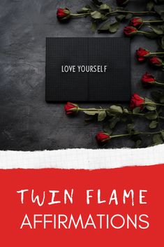 two red roses and a black card with the words love yourself written on it in white lettering