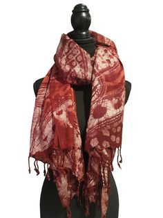 Adire Fusion: Tradition Meets Trend in Our Exclusive Scarf Collection! Elevate your style with our handcrafted 100% cotton scarves - each one a unique touch to your look. Let the wearable art make a statement and spark conversations.  Batik Scarf made with 100% Cotton Size approx. 57" X 26" Wear Your Pashmina As a Shawl. When it gets a little chilly, drape around your shoulders. ... Make a Full Shawl Wrap. ... Make an Artistic Knot. ... Wear As a Head Scarf. ... Create a Shorter Scarf. ... Dress Traditional Red Cotton Scarf, Traditional Red Cotton Scarves, Red Bohemian Cotton Shawl, Bohemian Red Cotton Shawl, Red Cotton Bohemian Shawl, Batik Scarf, Cotton Scarves, Short Scarves, Scarf Collection