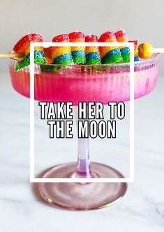 there is a pink drink with fruit on the top and text that reads, take her to the moon