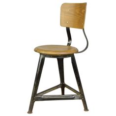 an old stool with a wooden seat and metal barstool on the back, against a white background