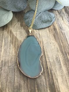 "This listing includes a Green Agate Necklace on a gold plated stainless steel chain. Each stone is unique and will not look exactly like the picture as each stone is natural and raw. It is rimmed in 24k Gold plating and will hang on a gold plated stainless steel chain in your choice of length. The average length is 30\". Please know that this is not the exact piece you will get. These are natural and each is unique in size, shape and color!! Each one measures approximately 50-74mm long. *Stainl Gold Chalcedony Jewelry As A Gift, Gold Moss Agate Pendant Jewelry, Gold Jewelry With Natural Moss Agate Stones, Gold Agate Wire Wrapped Necklace, Gold Moss Agate Spiritual Necklace, Bohemian Gold Jewelry With Moss Agate, Gold Agate Jewelry With Large Pendant, Gold Necklaces With Natural Stones And Chalcedony, Gold Necklaces With Natural Stones In Chalcedony