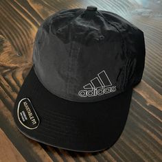 Men’s Urbansport Hat Aeroready Dry Technology Adjustable Fit Adidas Sporty Hat For Streetwear, Sporty Adidas Hats For Streetwear, Adidas Sporty Streetwear Hats, Adidas Casual Hat For Sports Events, Casual Adidas Hat For Sports Events, Casual Adidas Baseball Cap For Sports Events, Black Casual Dad Hat For Outdoor, Adidas Flat Bill Hat For Streetwear, Black Sports Dad Hat With Visor