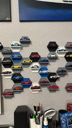 there are many cars on the wall in this office