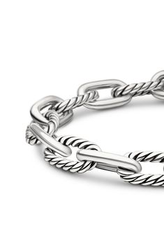 This chunky chain bracelet features alternating twisted and smooth links made of sterling silver and adds polished shine to any wrist stack. 7 1/2" length Push-clasp closure Sterling silver Imported Classic Sterling Silver Chunky Chain Bracelet, Classic Chunky Chain Bracelet, Classic Sterling Silver Bracelet With Chunky Chain, Classic White Gold Bracelets With Chunky Chain, Elegant Sterling Silver Chunky Link Bracelet, Classic White Gold Bracelet With Chunky Chain, Classic White Gold Chunky Chain Bracelet, Classic Silver Cable Chain Bracelet, Classic Sterling Silver Bracelet With Chunky Oval Links